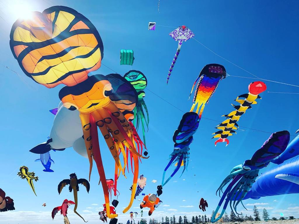 Close-up shot of colourful kites in the sky.