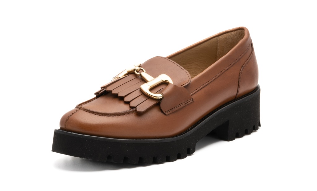 Tan, chunky loafer with gold buckle and tassels. 